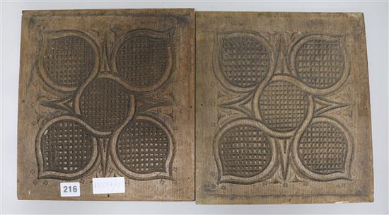 A pair of carved wood panels